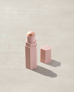 Match Stix Shimmer Skinstick shown in shade I Scream on a concrete background. 